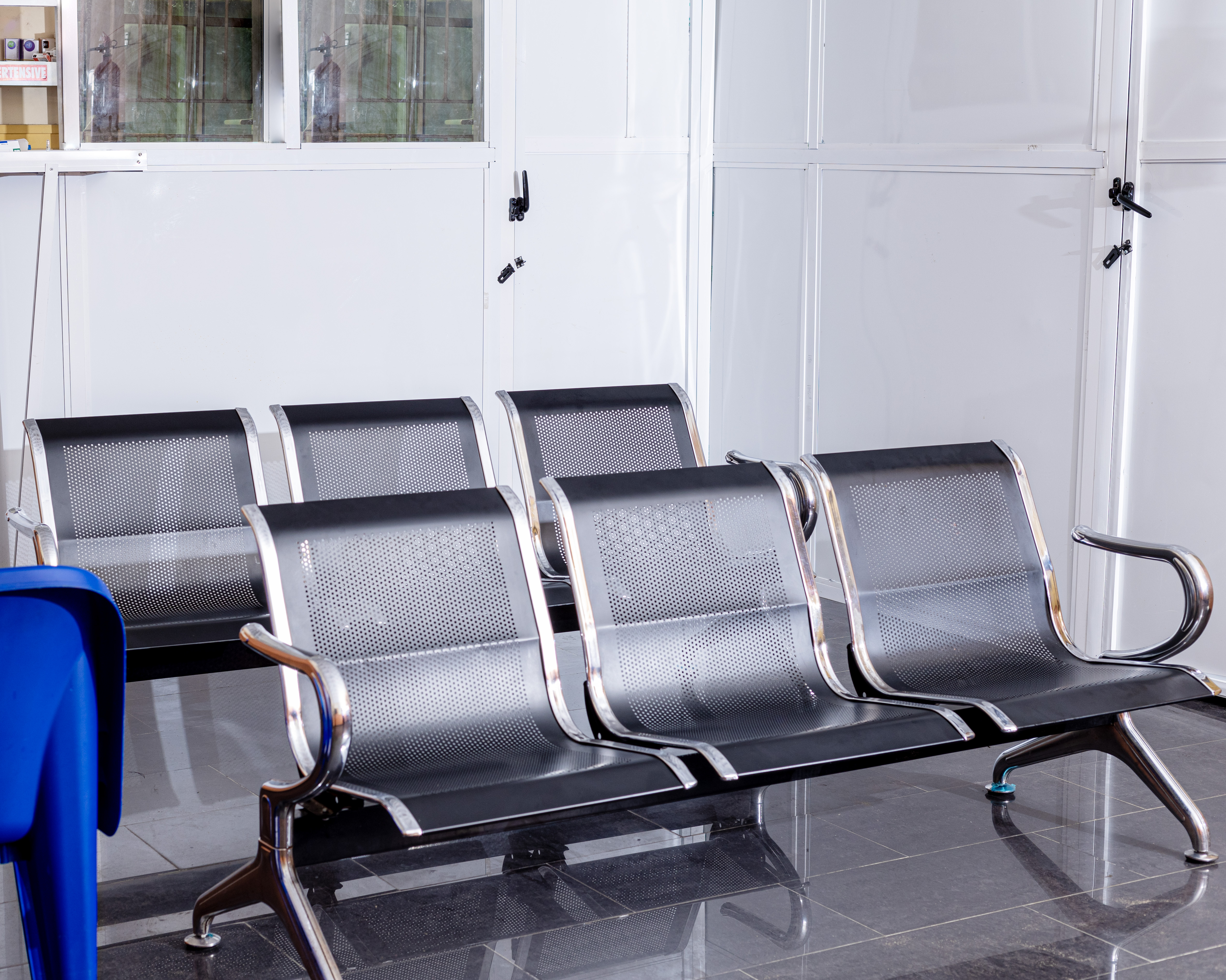 Bright hospital waiting area with seating and plants